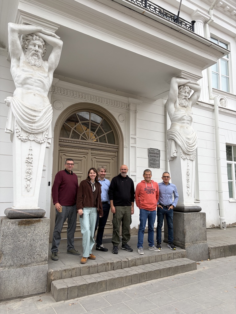 Six members of the ClimateSense team standing on the steps of a building entrance in Vilnius, October 2026